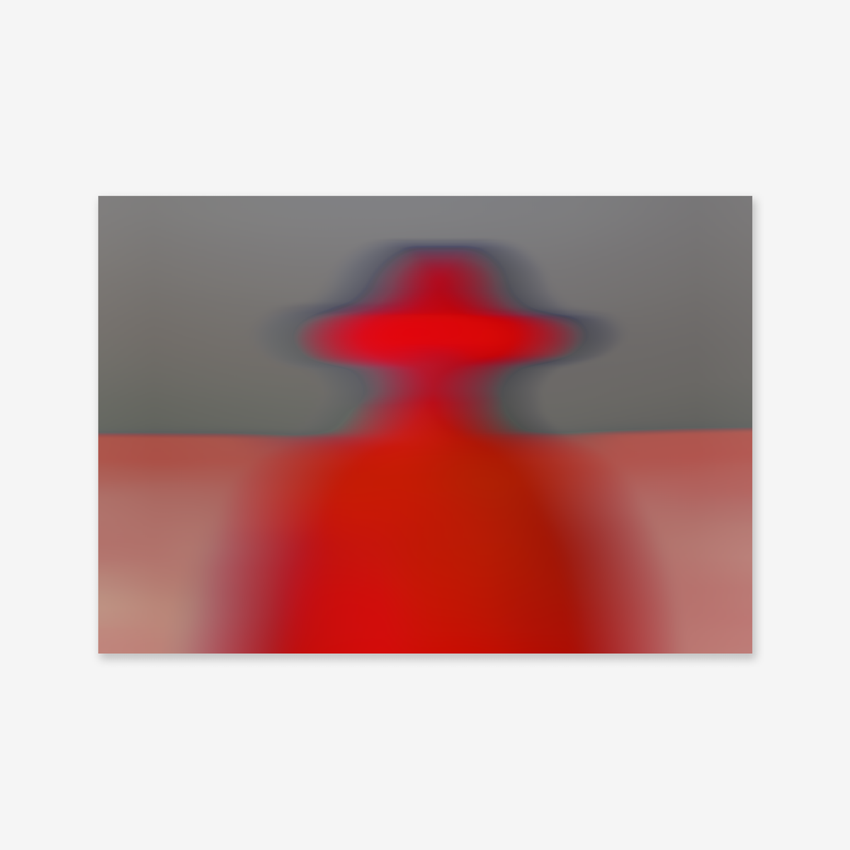 Blurry cowboy" is a giclée art print featuring an abstract red figure in a wide-brimmed hat against gray and muted red tones, adding a mysterious, modern touch to any interior.