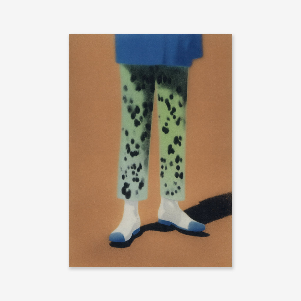 The "Fancy pants" giclée art print features a stylized image of legs in green pants with black spots, white socks, and blue shoes on a brown surface—perfect for adding modern flair to your interior.