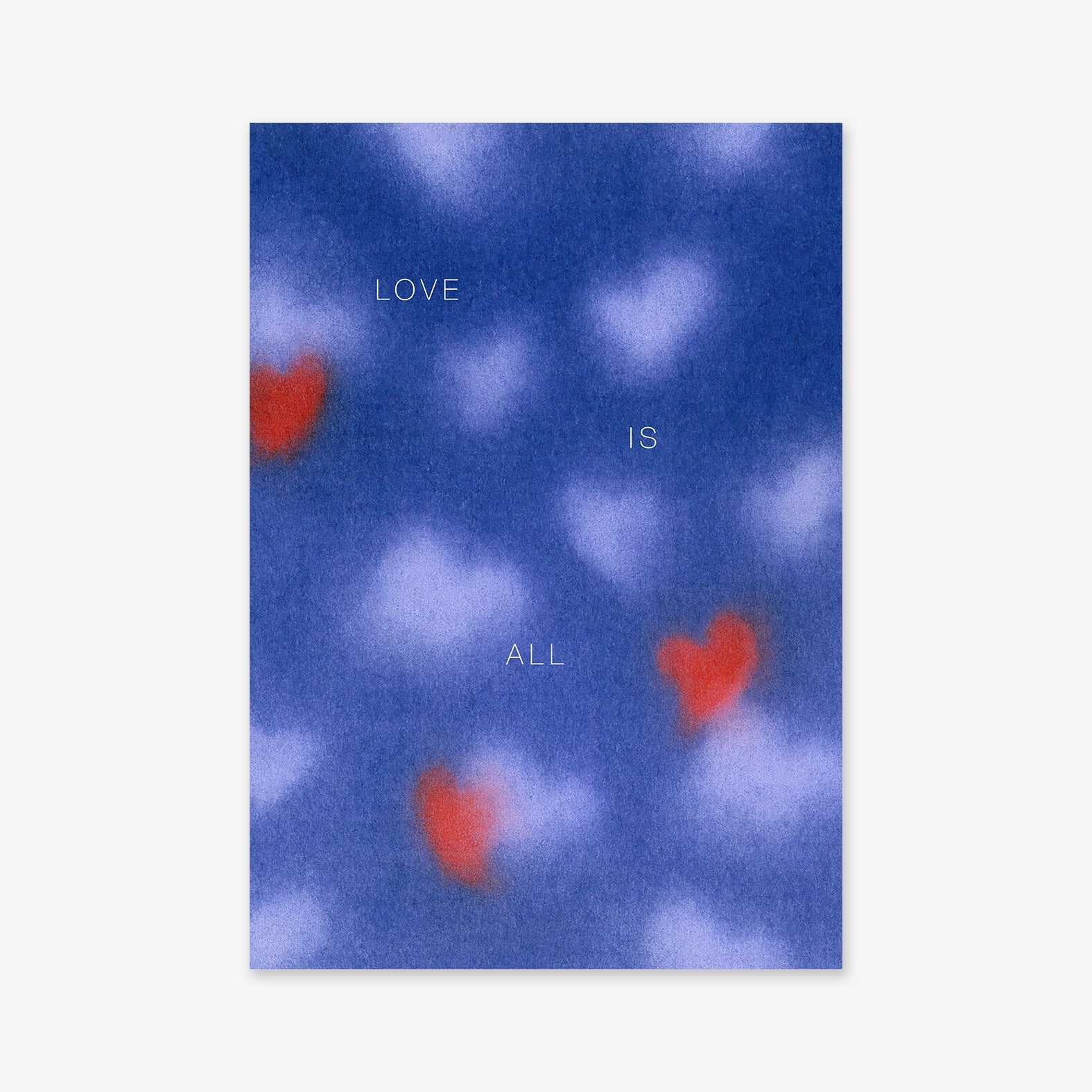 Love is all features a blue background with soft, blurry white and red heart shapes. The words "LOVE IS ALL" appear in minimalist white text—an ideal Giclée art print to brighten modern interiors.
